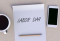 LABOR DAY, message on paper, smart phone and coffee on table
