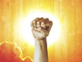 Labor Day photography concept, closeup of the raised fist of a young man