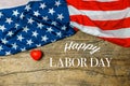 Labor Day Text and Little Red Heart Over Old Wood Wall Texture Background and American Flags Royalty Free Stock Photo