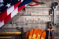 Labor Day, USA America flag with many handy tools on wooden background texture Royalty Free Stock Photo