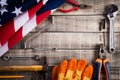 Labor Day, USA America flag with many handy tools on wooden background texture Royalty Free Stock Photo