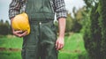 Labor Day. The worker holds a helmet in his hands.