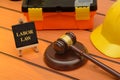 Labor law theme with wooden gavel on table, legislation concept Royalty Free Stock Photo