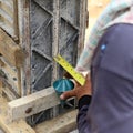 Labor man using a plumb bob for check Royalty Free Stock Photo