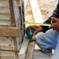 Labor man using a plumb bob for check Royalty Free Stock Photo