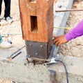 Labor man using a plumb bob for check pillar Royalty Free Stock Photo