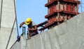 Labor man working on construction site with helmet. Royalty Free Stock Photo