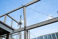 labor man working high concrete pile no safety . Worker risk on top structure home building site. white small cloud on blue sky Royalty Free Stock Photo