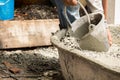 Labor pouring cement for build new floor for renovation house