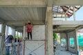 labor working in new house structure use lightweight cement brick and white lintel plaster to joint for reinforce in site.steel