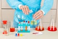 Laboratory assistant is conducting chemical experiments in laboratory