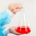 Laboratory assistant hands is conducting chemical experiments in laboratory