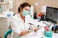 Laboratory assistant holds test tubes for gynecological and cytological analysis. Woman scientist working in medical lab Royalty Free Stock Photo