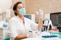 Laboratory assistant holds test tubes for gynecological and cytological analysis. Woman scientist working in medical lab Royalty Free Stock Photo