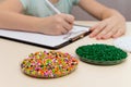 Laboratory assistant inspections plastic pellets for industry. P Royalty Free Stock Photo