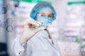 A laboratory assistant is organizing the digital system consisted of different medical and lab symbols and icons