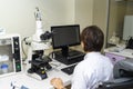 Laboratory assistant performs a blood test in a modern laboratory on the analyzer