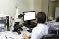 Laboratory assistant performs a blood test in a modern laboratory on the analyzer