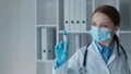 A laboratory assistant in a pharmaceutical laboratory uses a syringe to measure components in detail and create high