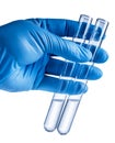 Laboratory beakers in analyst`s hand in plastic glove. Royalty Free Stock Photo