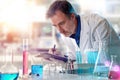 Laboratory chemical technician writing down results in a folder front