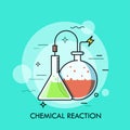 Laboratory conical and round-bottom flasks filled with colorful liquids and connected by wire. Concept of chemical