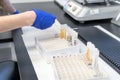 woman in laboratory doing tests for vaccine blood extraction and analytical