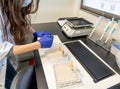 woman in laboratory doing tests for vaccine blood extraction and analytical