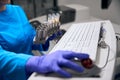 Laboratory employee uses modern equipment to analyze biomaterial