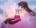 Laboratory Experiment with Pink Liquid in Flask Royalty Free Stock Photo