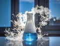 Laboratory Flask with Blue Liquid and Vapor Effect in Modern Science Setting Royalty Free Stock Photo