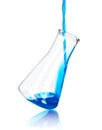 In laboratory flask pours blue reagent Royalty Free Stock Photo