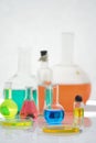 Laboratory flasks and beakers with liquids of different colors on lab table Royalty Free Stock Photo