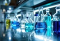 Laboratory glassware filled with colorful liquids on a modern science bench Royalty Free Stock Photo