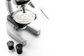 Laboratory for food analysis. Rice under the microscope on white background copyspace