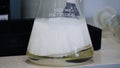 Laboratory glass Erlenmeyer conical flask filled with chemical white liquid for a chemistry experiment in a science