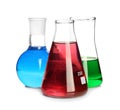 Laboratory glassware with colorful liquids on white background Royalty Free Stock Photo