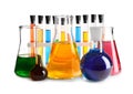 Laboratory glassware with colorful liquids on white background Royalty Free Stock Photo