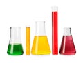 Laboratory glassware with colorful liquids on white background Royalty Free Stock Photo