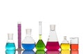 Laboratory glassware with colorful liquids on white background