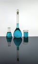 Laboratory glassware containing Blue solutions Royalty Free Stock Photo