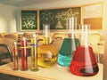 Laboratory glassware with formula on blackdesk in the school