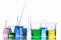 Laboratory glassware with liquids of different colors Royalty Free Stock Photo