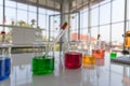 The laboratory glasswares, scientific glasswares or beakers with different color liquid was set on the white table in the Royalty Free Stock Photo