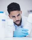 Laboratory, man or scientist reading bottle to check medical stock or info on cure breakthrough. Research study Royalty Free Stock Photo