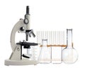 Laboratory metal microscope and test tubes with liquid isolated Royalty Free Stock Photo