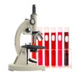 Laboratory metal microscope and test tubes with liquid isolated Royalty Free Stock Photo