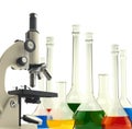 Laboratory metal microscope and test tubes with liquid isolated Royalty Free Stock Photo