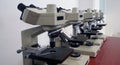 Laboratory microscopes stacked together