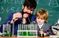 laboratory research and development. bearded man teacher with little boy. Laboratory test tubes and flasks with liquids